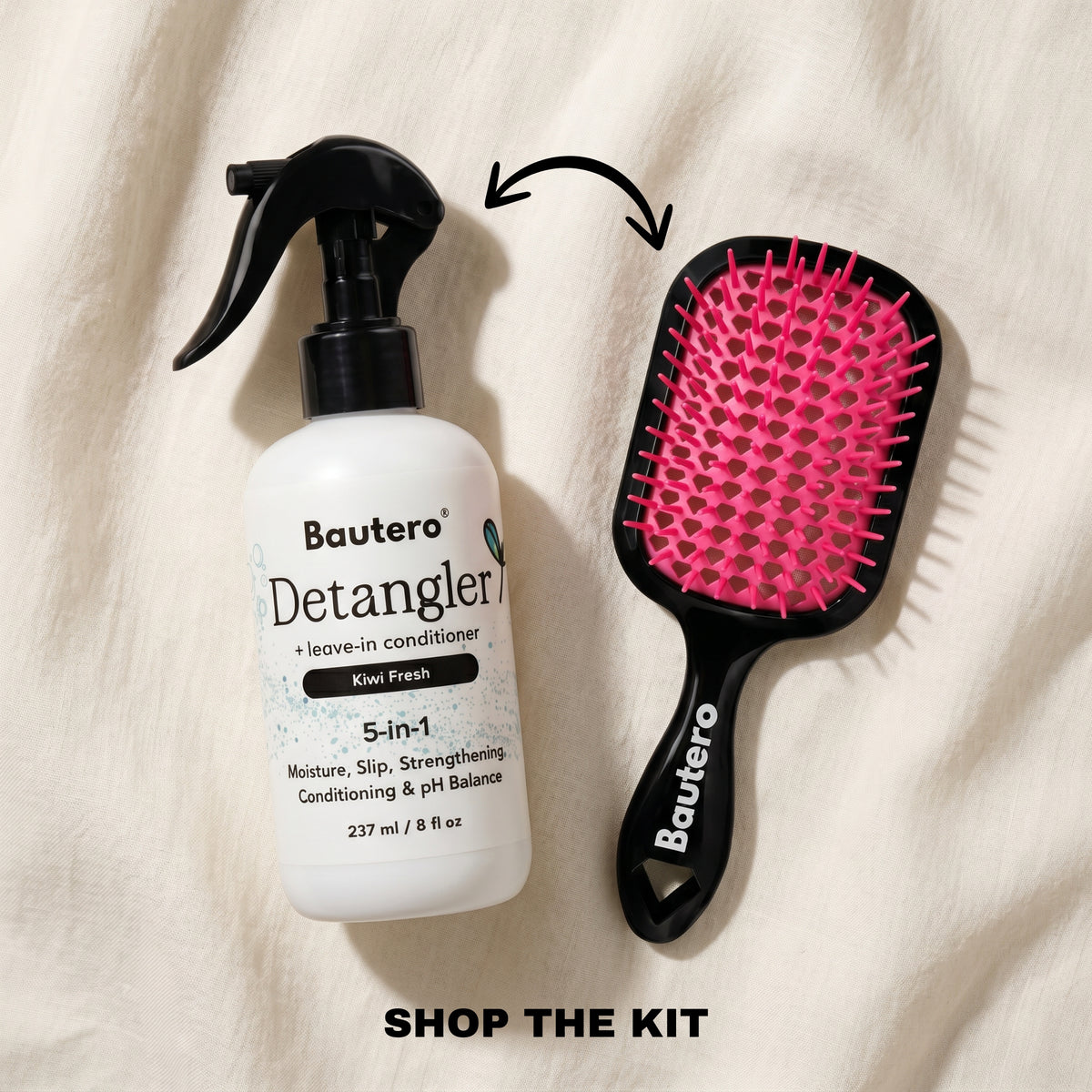 Bautero Detangler leave-in conditioner spray bottle next to Sakura Blossom Bautero brush
